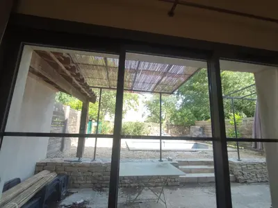 a view from the inside of a house with a window at la redorte 25 in La Redorte