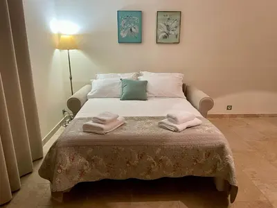a bedroom with a bed with two towels on it at La Redorte 28 in La Redorte