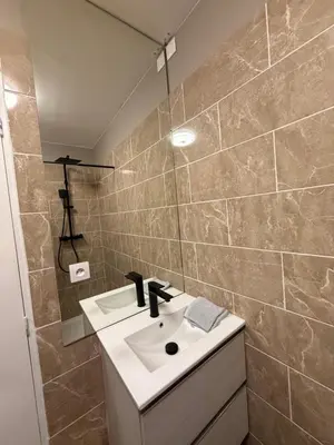 a bathroom with a sink and a mirror at studio centre ville in Narbonne