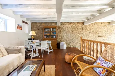 a living room with a couch and a table at L'Échappée Belle - Grande Maison, Jardin & Piscine in Castres
