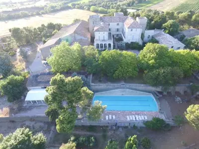 an aerial view of a large house with a swimming pool at maison des Géraniums in Trausse