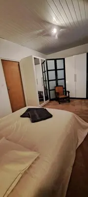 a bedroom with a large bed in a room at Le nid du canal in Pezens