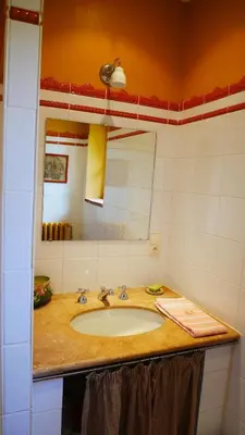 a bathroom with a sink and a mirror at Maison Chérie Artisanal Farmhouse in Villarzel-du-Razès