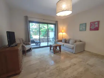 a living room with a couch and a tv at La Redorte 24 in La Redorte