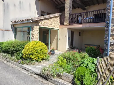 a house with a garden in front of it at Gîte le Courdel in Les Brunels