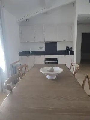 a kitchen with a table with a plate on it at La Redorte 17 in La Redorte