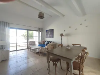 a living room with a table and a couch at La Redorte 17 in La Redorte