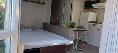 a small room with a bed and a table in it at El sol in Port-la-Nouvelle