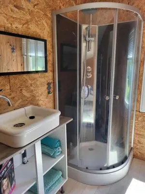 a bathroom with a shower and a sink at A la campagne in Saint-Denis