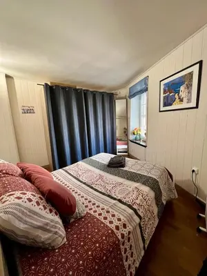 a bedroom with two beds and a window at Bienvenue chez Sandrine in La Redorte