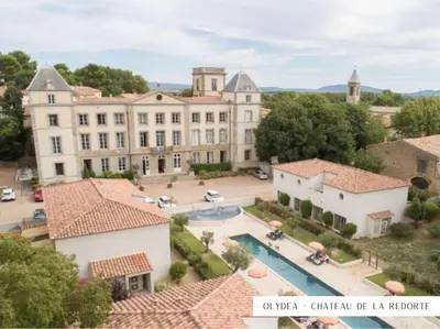 an aerial view of a large building with a pool at Bienvenue chez Sandrine in La Redorte
