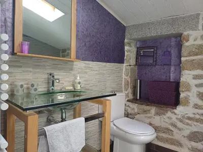a bathroom with a sink and a toilet at Sidobre in Lacrouzette