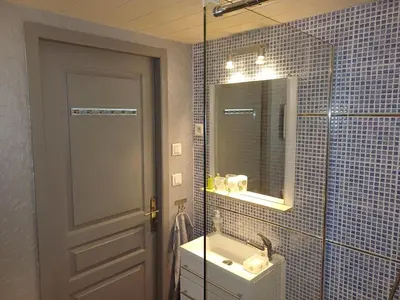a bathroom with a sink and a mirror at Sidobre in Lacrouzette