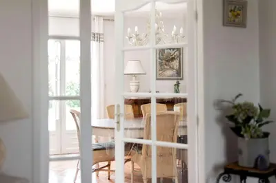 a dining room with a table and chairs at Villa La Cavayere swimming pool air conditioning in Carcassonne