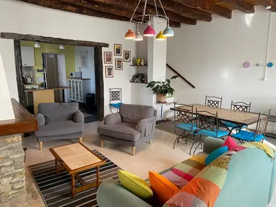 a living room with a couch and a table at La maison Pont Rouge in Carcassonne