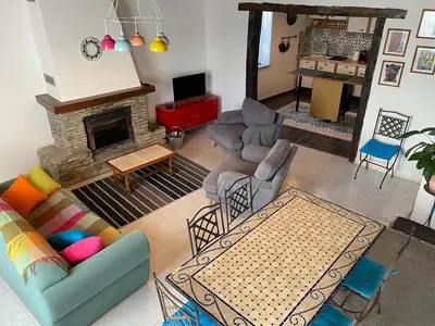a living room filled with furniture and a fireplace at La maison Pont Rouge in Carcassonne