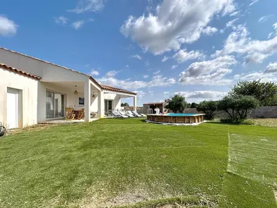 a large yard with a pool and a house at Villa Grivia - Maison avec grand jardin - Piscine - Pétanque - Ping Pong in Saint-André-de-Roquelongue