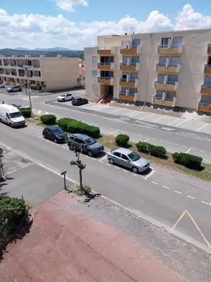 an aerial view of a city street with cars parked at Appartement T2 lumineux à 200m de la plage, tout équipé in Port-la-Nouvelle