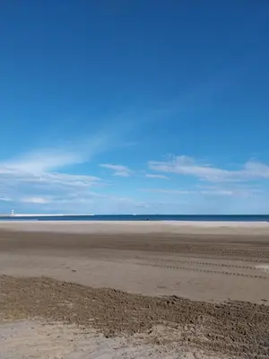 an empty beach with the ocean in the background at Appartement T2 lumineux à 200m de la plage, tout équipé in Port-la-Nouvelle