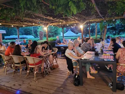a group of people sitting at tables in a restaurant at Studiotel premium 2 personnes in Pamiers