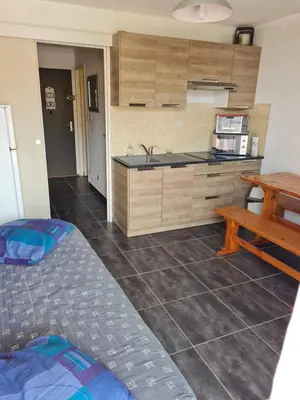 a kitchen with a sink and a counter at Quatre Vent in Gruissan