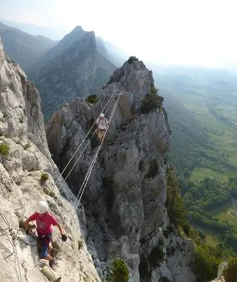 two people on a rope on the side of a mountain at Renovated and air-conditioned 2-bedroom apartment with terrace in Saint-Paul-de-Fenouillet