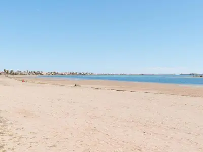 a beach with the ocean in the background at Villa T3 à Gruissan avec climatisation et jardin - FR-1-409A-36 in Gruissan