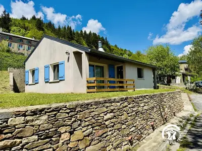 a house with a stone wall at Nore & nature in Pradelles-Cabardès