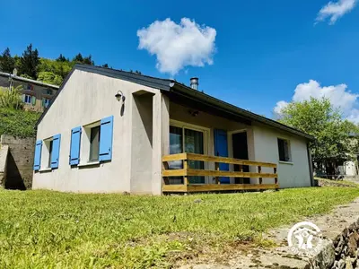 a house with a porch and a fence at Nore & nature in Pradelles-Cabardès