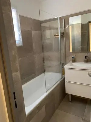 a bathroom with a shower and a sink at La Petite Villa du Soleil in Lavalette