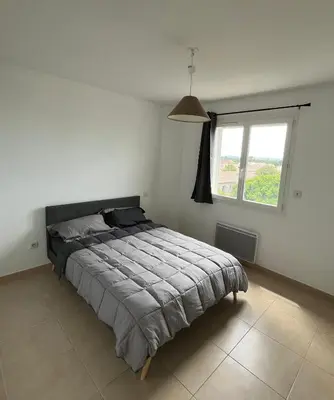 a bedroom with a bed and a window at Villa Vinassan in Vinassan