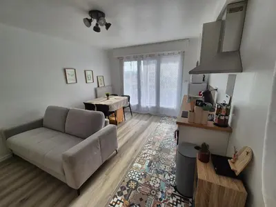 a living room with a couch and a table at Loni in Carcassonne