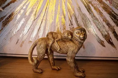 a statue of a mother monkey with her baby at Loft & Spa Scandinave Romantique, King Size, TV 65 in Narbonne