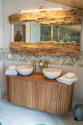 a bathroom with two sinks and a mirror at Loft & Spa Scandinave Romantique, King Size, TV 65 in Narbonne