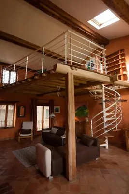 a living room with a loft bed and a couch at Pure Canigou House An Authentic and Charming Town house with 3 bedrooms in Montalba-le-Château