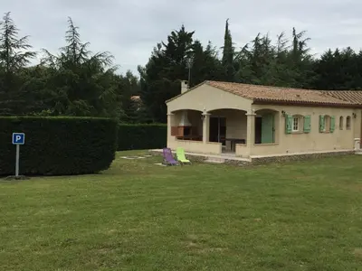 a small house in a yard next to a yard at Gites De La Grasse in Carcassonne