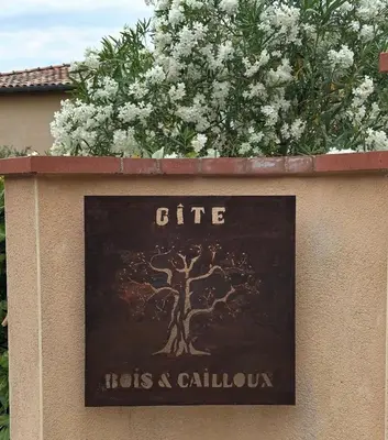 a couple of bushes in a garden at Les gîtes du Canal du midi - Gîte Bois & Cailloux in Montgaillard-Lauragais