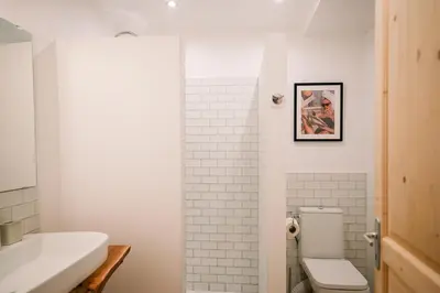 a bathroom with a toilet and a sink at Steinhaus mit Dachterrasse und Badefluss in Ribaute