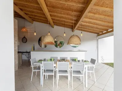 a kitchen and dining room with a table and chairs at Magnificent villa with private pool in Narbonne