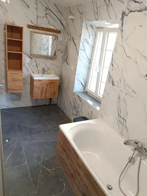 a bathroom with a tub and a sink at Château de Prax Viel - piscine et mini ferme, climatisé in Lagrasse