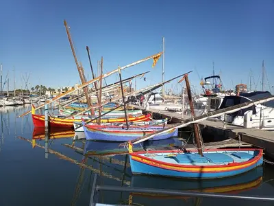 a group of boats are docked at a dock at Chez Jacques in Port-la-Nouvelle