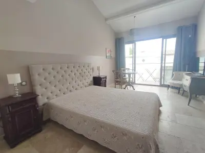 a bedroom with a bed and a table and a window at LA REDORTE Studio 15 in La Redorte