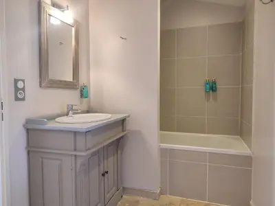 a bathroom with a sink and a bath tub at LA REDORTE Studio 15 in La Redorte