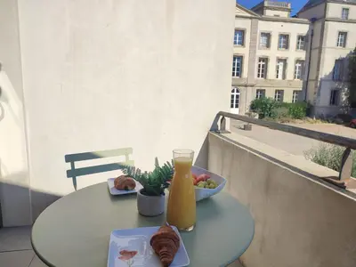 a table with a bowl of food and a bottle of orange juice at LA REDORTE Studio 15 in La Redorte