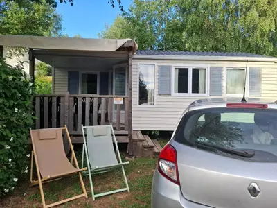 a car parked in front of a tiny house at Lya in Nages