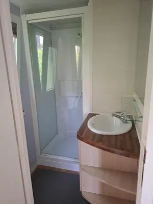 a bathroom with a sink and a shower at Lya in Nages