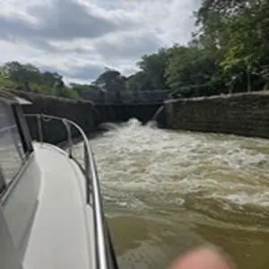 a boat in a river with rapids at bateau tinkerbell in Labastide-dʼAnjou