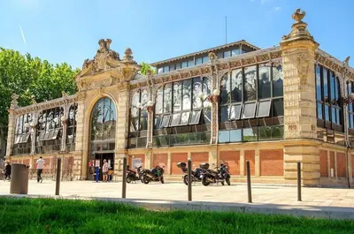 a building with motorcycles parked in front of it at L'Appart Central - Chic et Confort in Narbonne