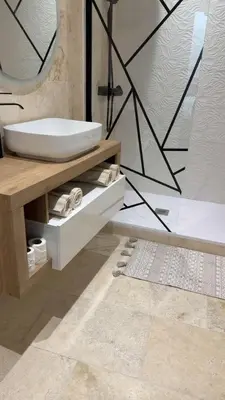 a bathroom with a sink and a mirror at Le petit narbonnais in Narbonne