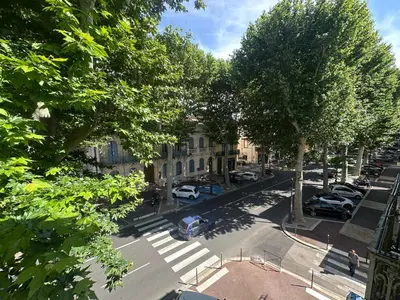 an aerial view of a city street with cars parked at Centre ville, grand T3 avec balcon in Narbonne